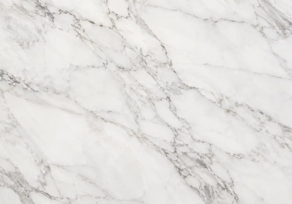 Afyon White pavers and steps beside polished interior flooring, wall panels and countertop with crystalline white tones.