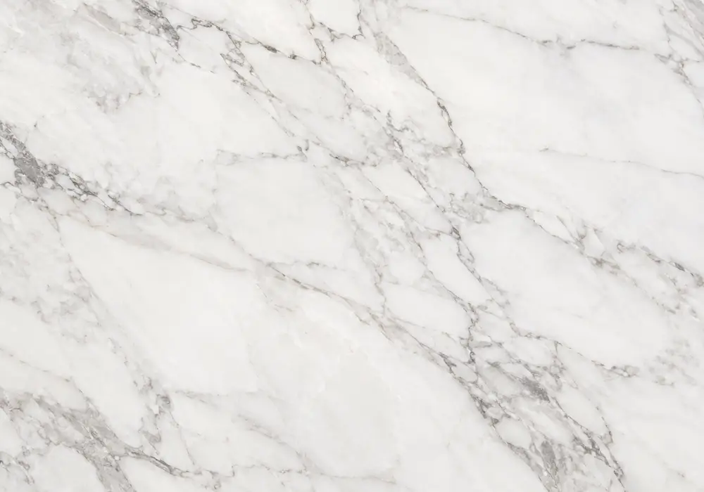 Orobico Rosso marble on a polished island and backsplash with honed flooring, showing layered cream, gold and burgundy waves.