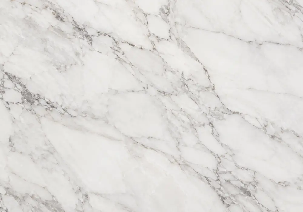 Bright Ariston White Marble features fine grey-beige veins and crystalline depth, representing Greek Drama-region marble.