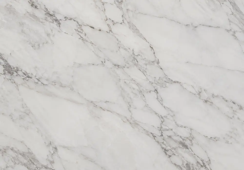 Avalanche countertop on polished waterfall island and backsplash with honed floor, showing cascading grey and gold waves.
