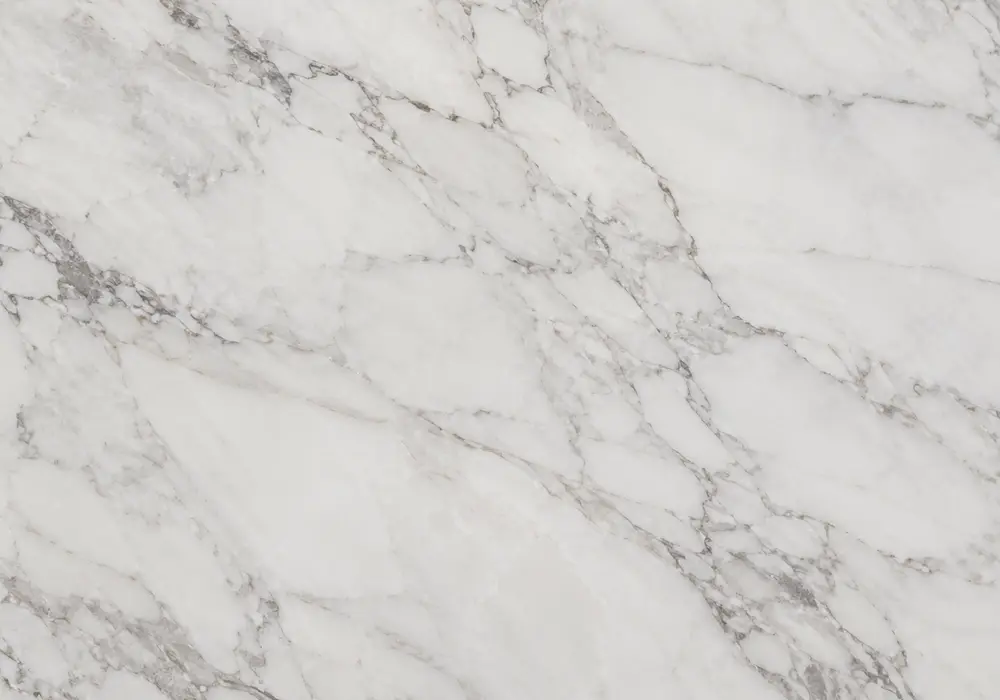 Cloudy silver-grey movement and soft white veins define this polished slab, supporting accurate Badal marble disambiguation.