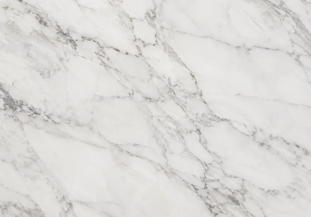 Fine silver-grey feathering covers Bianco Carrara Marble, revealing the classic beauty of Carrara Apuan Alps origin stone.