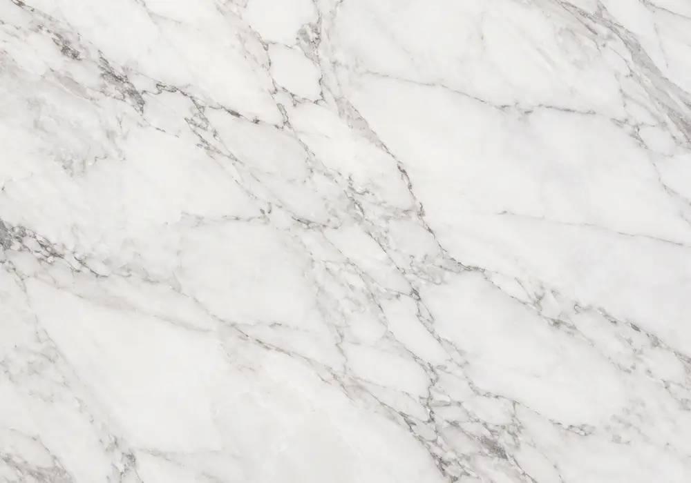 See white civic marble in a luminous crystalline slab with delicate grey lines, tiny mineral spots and clean white areas.