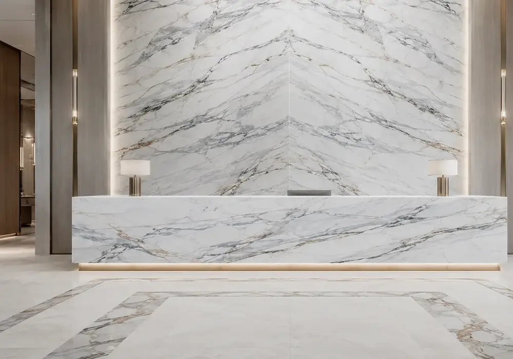 Lasa Covelano marble in a gallery interior, showing authentic veining, polished stone depth and balanced interior lighting.