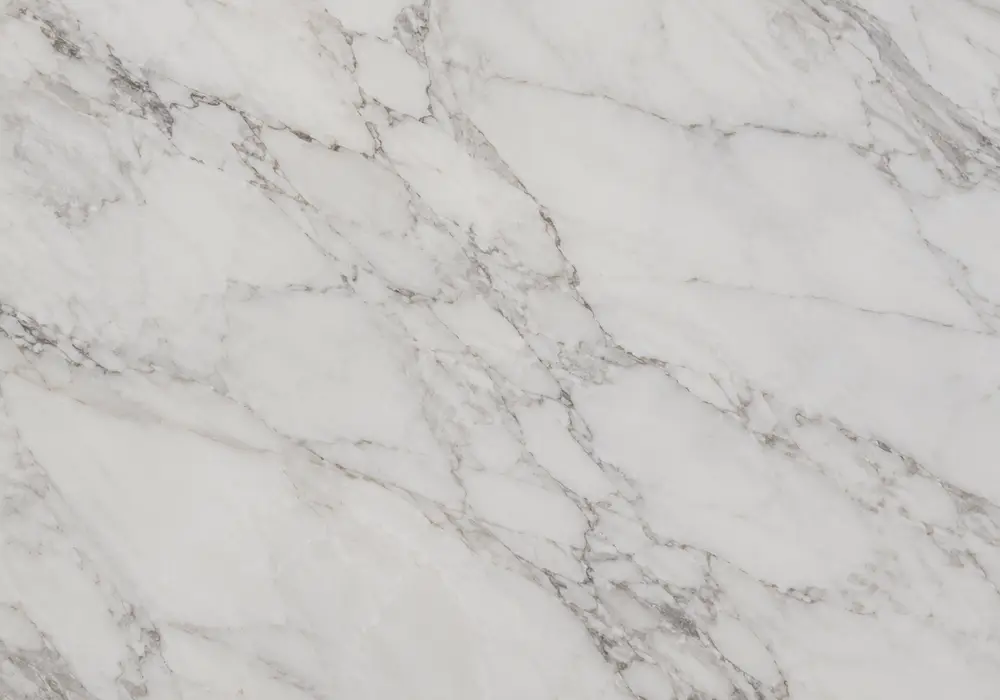 Greek white marble UAE on flooring, kitchen island and reception surface with bright white fields and silver-grey veins.