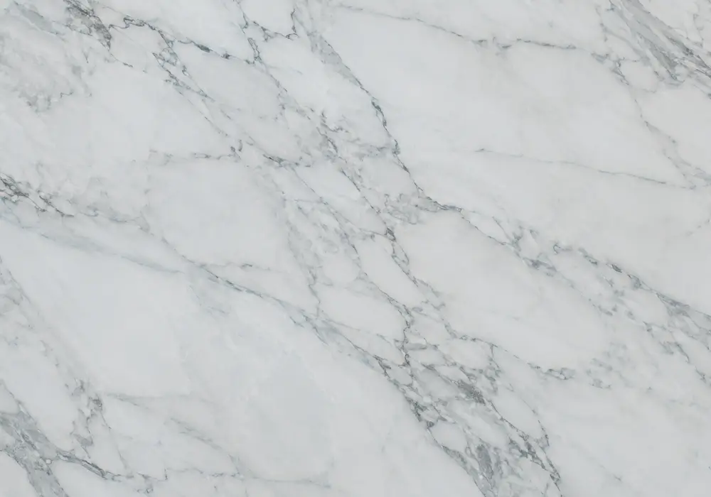 Pastel blue and silver clouds drift through polished stone, highlighting the ethereal Chinese Blue Sky marble character.