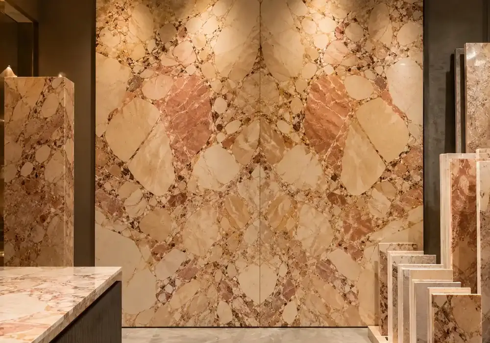 Breccia Aurora Marble bookmatched wall panel with mirrored stone movement in a sophisticated architectural gallery