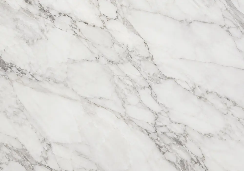 Calacatta Beige marble featured in a boutique hotel lobby, showing natural texture, depth and refined architectural detail.