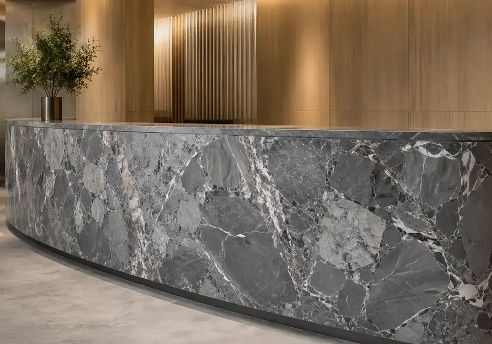 Silver Breccia marble in a hotel lobby, with natural mineral movement, realistic depth and refined architectural detailing.