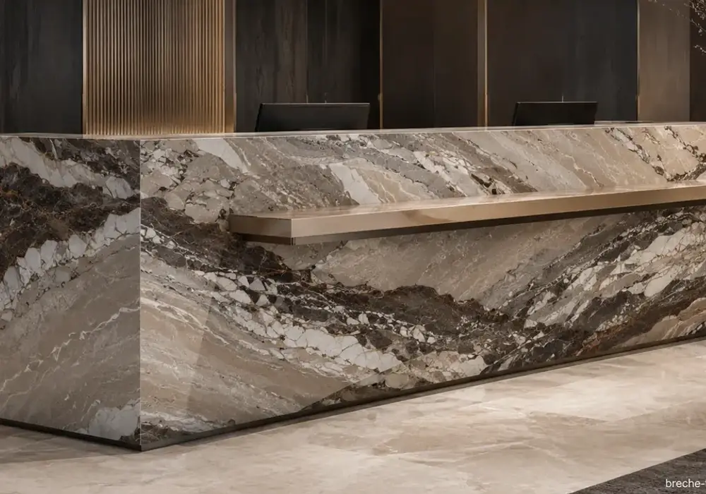 Breche Fantastique panel in a boutique hotel lobby, showing natural veining, polished depth and refined architectural detail.