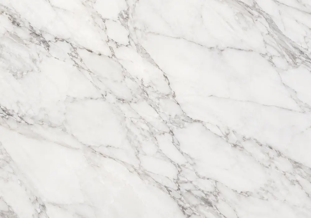 Calacatta Crema marble bookmatched feature wall with warm ivory stone and flowing grey, bronze and gold veins.