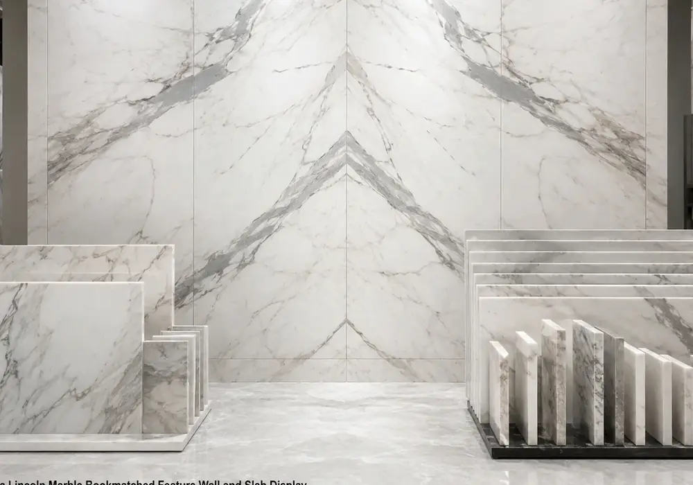 Colorado Yule marble displayed in white and grey tones with branching veins and natural veining, across the polished surface.
