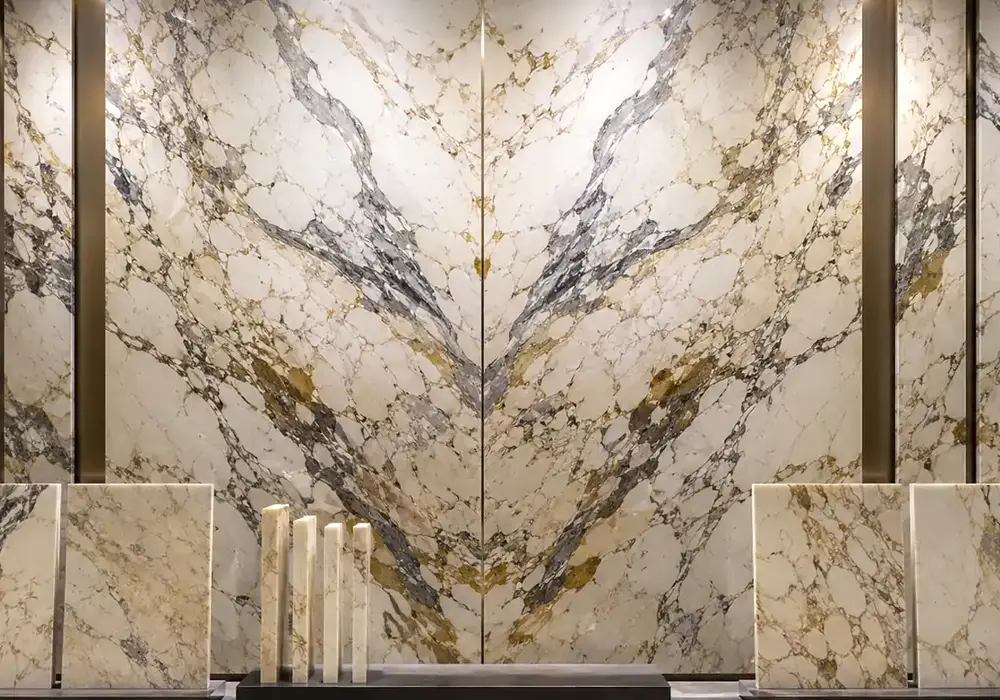 Macchia Vecchia bookmatch formed from consecutive ivory slabs with grey, amber and gold movement into a finished feature wall