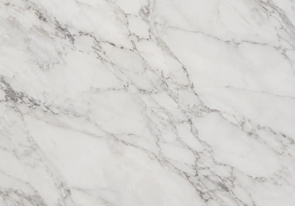 Broad grey and muted-gold ribbons cross luminous Calcutta Marble, serving as a clear Calacatta misspelling guide reference.