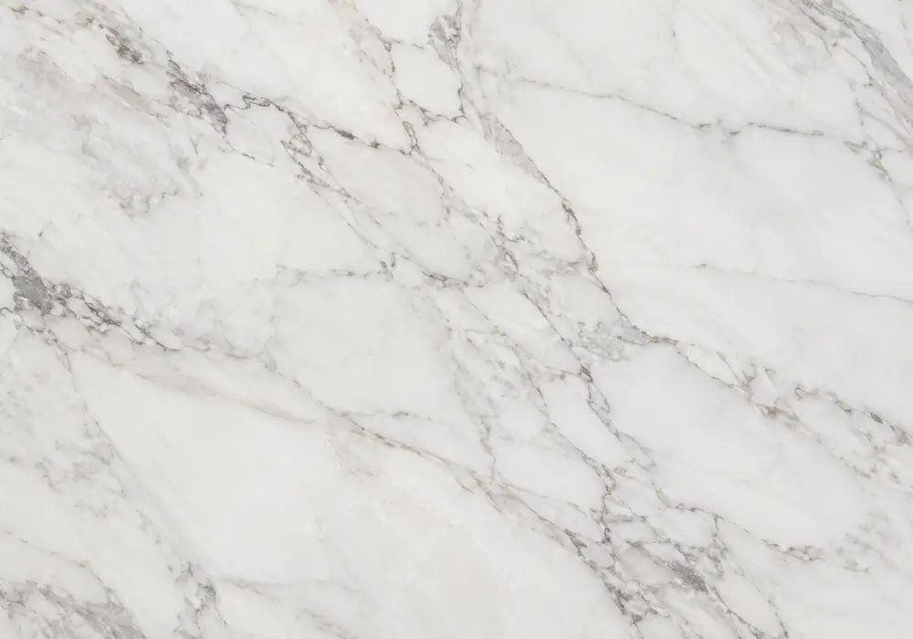 Cappuccino Brown marble in a warm hotel lobby, showing authentic veining, polished surfaces and balanced interior lighting.