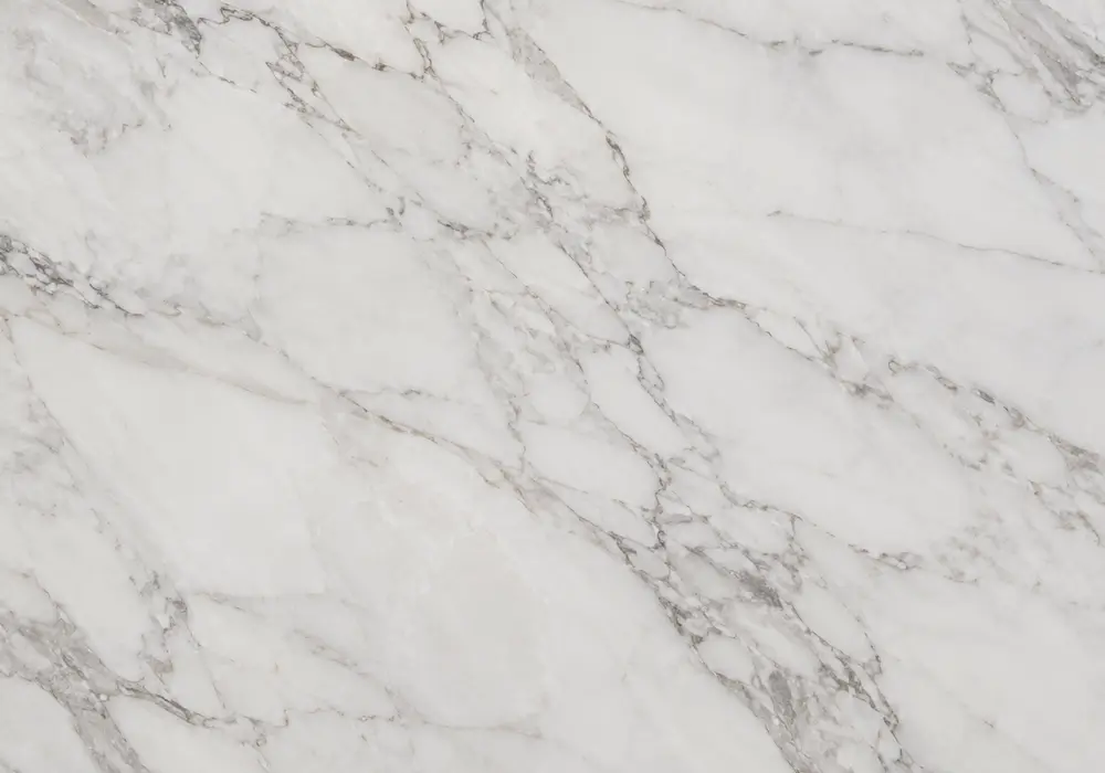 mica-rich marble veins flow through a polished fireplace, reception desk and custom table with folded green-grey banding.