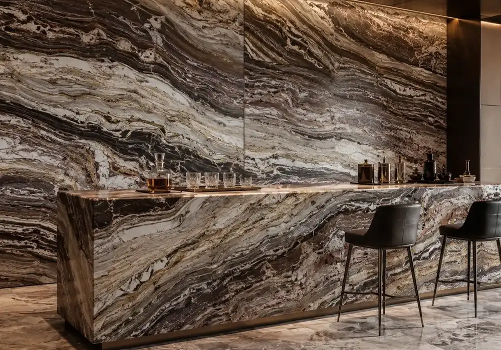 Karystian marble on polished countertop and feature wall with sage folded bands, emerald lines and rippling onion layers.