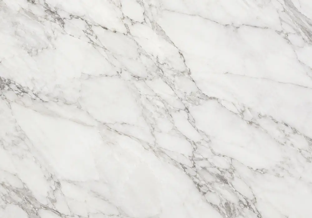 Cream Karaman marble reception wall with warm cream, beige and smoked-grey tones in a refined luxury interior.