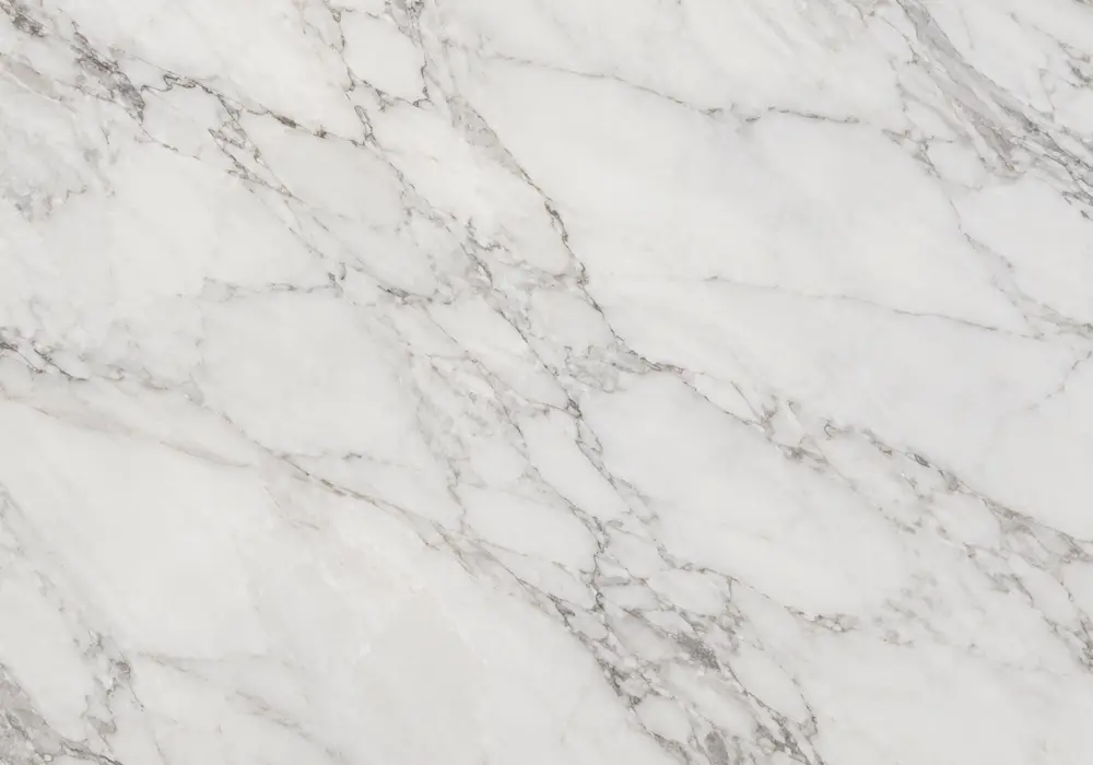 Crema d'Orcia sink sculpted from pale cream stone with matching wall panels, flooring and bespoke furniture in refined space.