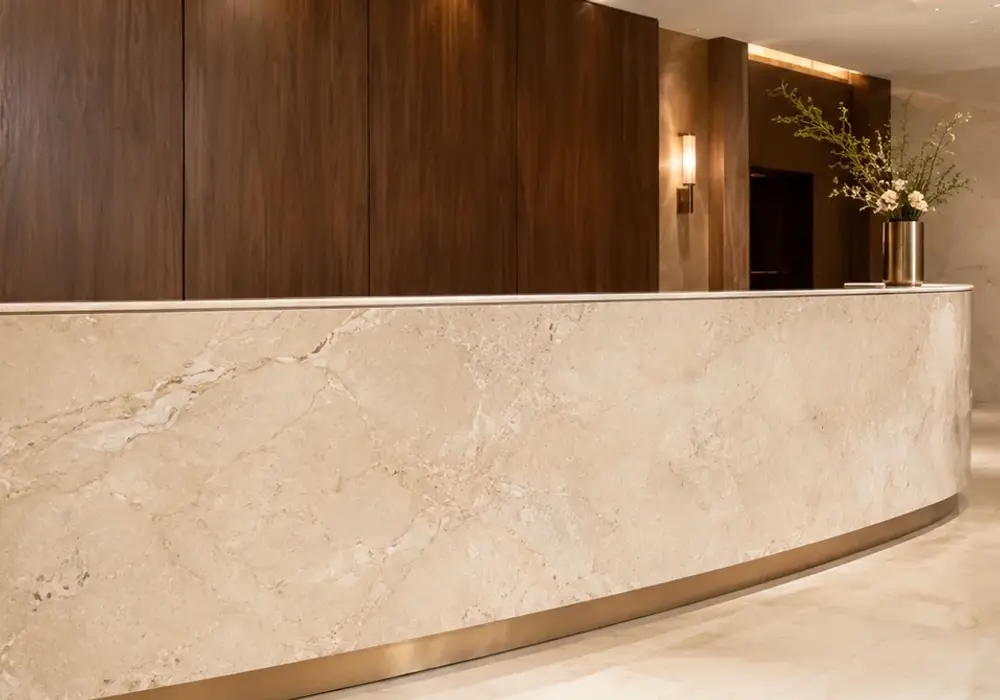 creamy beige background in a five-star hotel lobby, showing realistic veining, true stone texture and architectural detail.