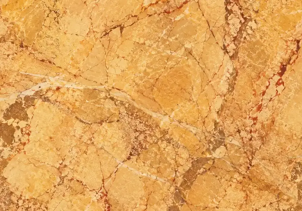 Crema Valencia slabs featured in a Mediterranean hotel lobby, showing natural stone depth and refined architectural detail.