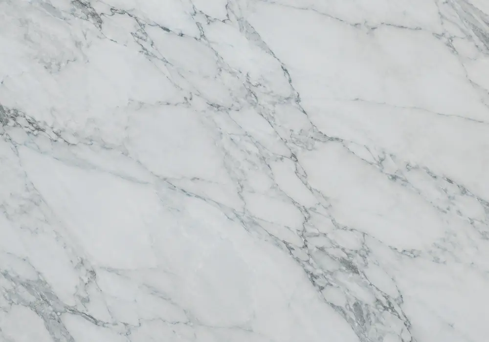 white cloud variation moves through icy blue slabs, precision-cut pieces and edge profiles with polished and honed samples.