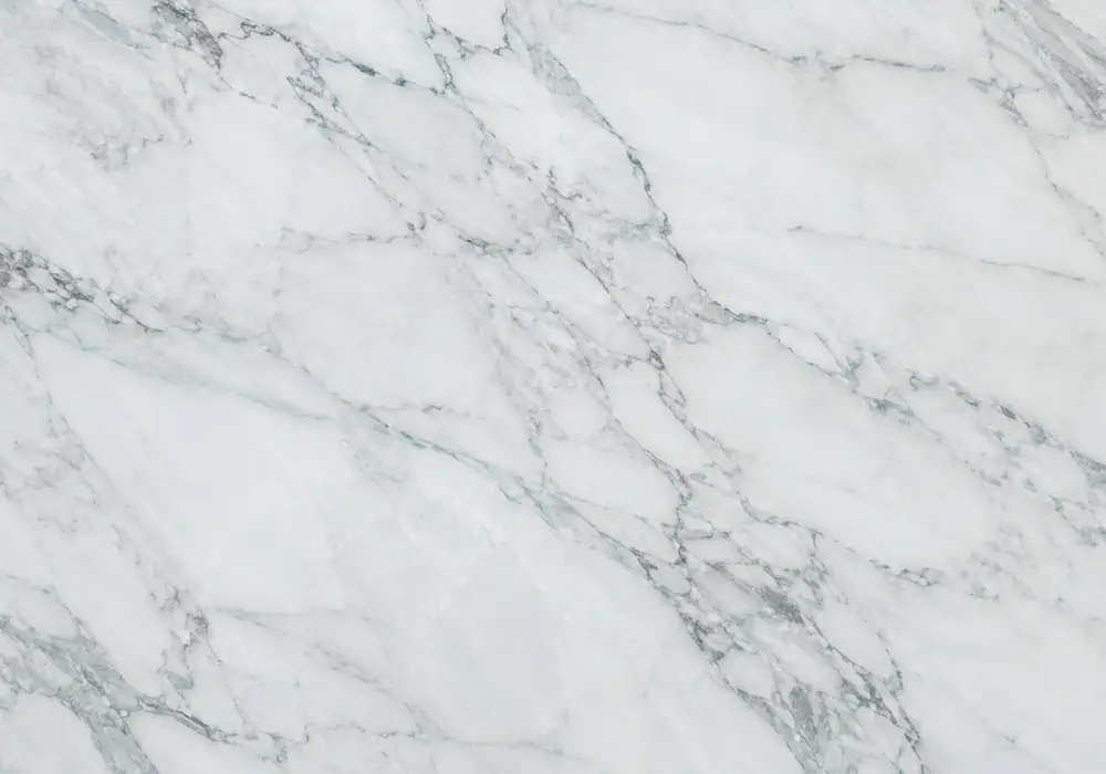 Crystal Blue Marble polished and honed stone display in a premium showroom with large slabs and refined surfaces