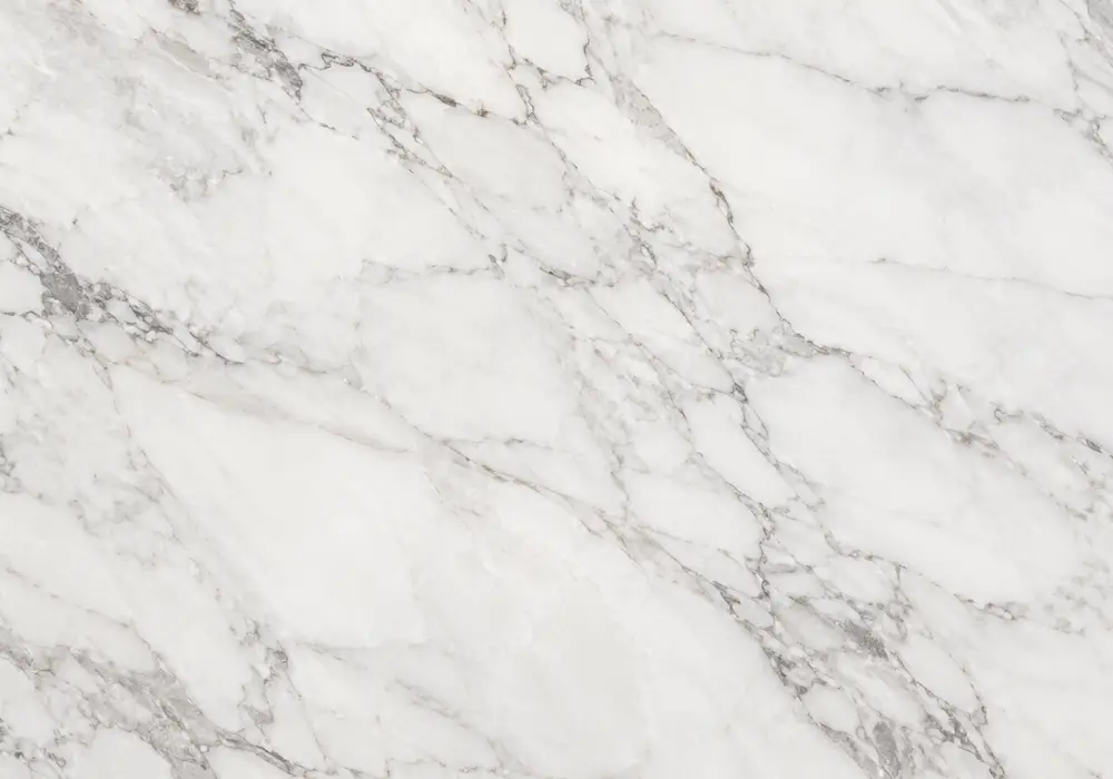 Crystal White marble price image featuring white and silver, clouded movement and mineral specks, and controlled reflections.