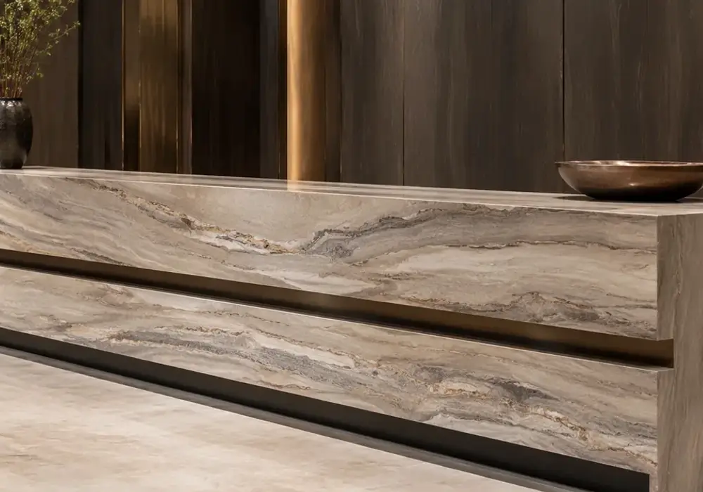 Da Vinci marble fireplace surround with rich brown, coffee, taupe and cream veining in a luxury stone gallery.
