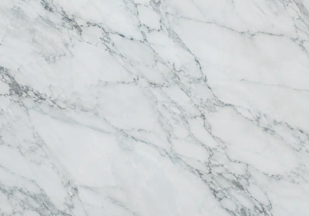 dark blue marble types visual of blue and white stone shaped by branching veins and flowing waves, across a luminous surface.