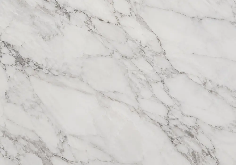 grey vs black marble on polished counter, vanity and fireplace, comparing linear charcoal with cloudier dark-grey stone.