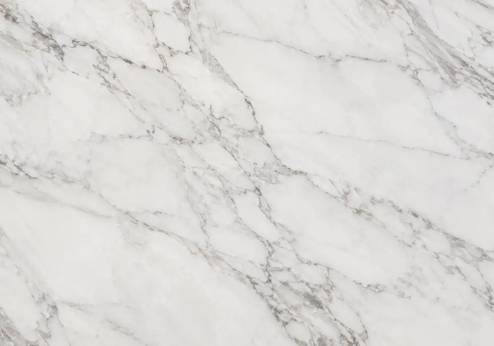 Graphite stone with white fractures and smoky mineral clouds presents the refined dark grey marble category surface design.