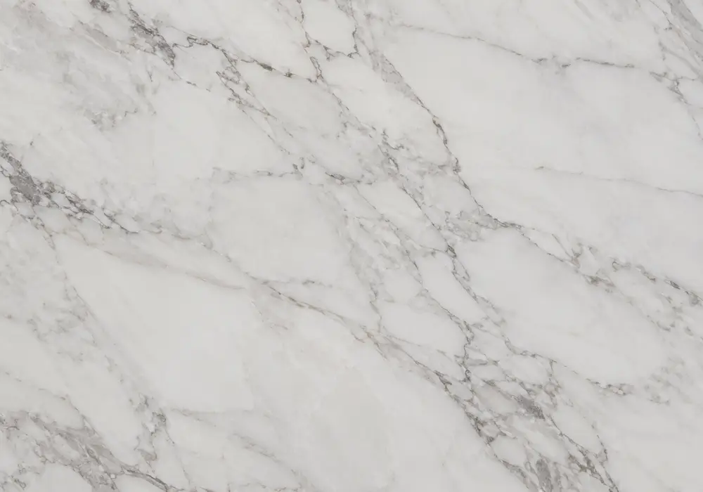 Warm-toned Oman Desert Rose marble slab with creamy sand, dusty blush tones and delicate rose-brown flowing mineral lines.