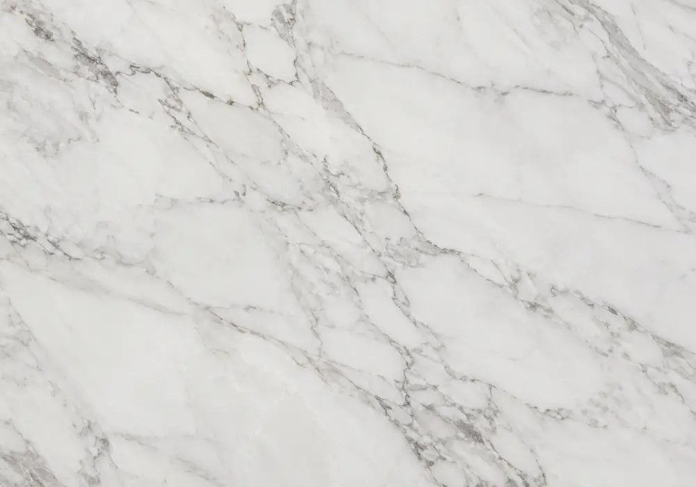 Diana Beige marble reception feature panel with warm cream-beige stone and subtle flowing taupe veins