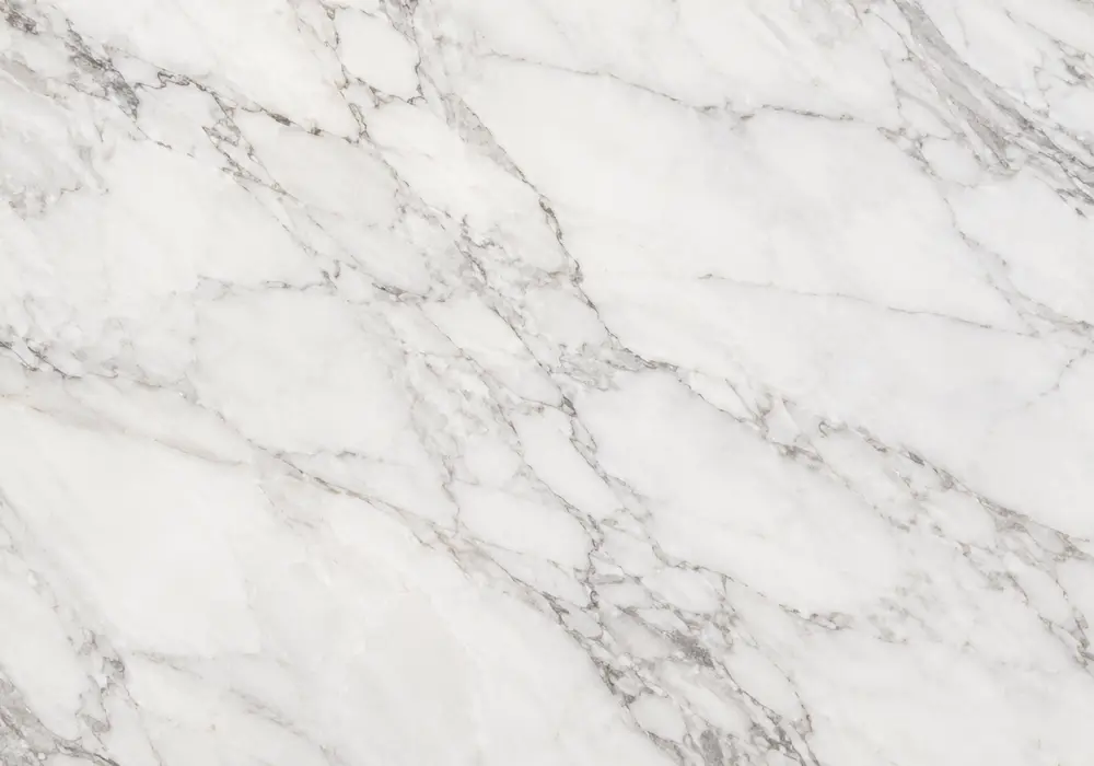Spanish Emperador marble in a hotel lounge, with natural veining, polished stone depth and refined architectural character.