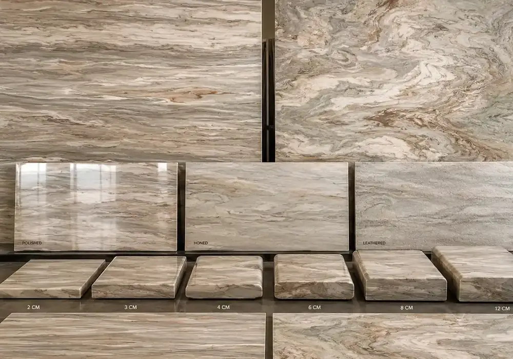 Fantasy Brown Marble polished and honed stone display in a premium showroom with large slabs and refined surfaces