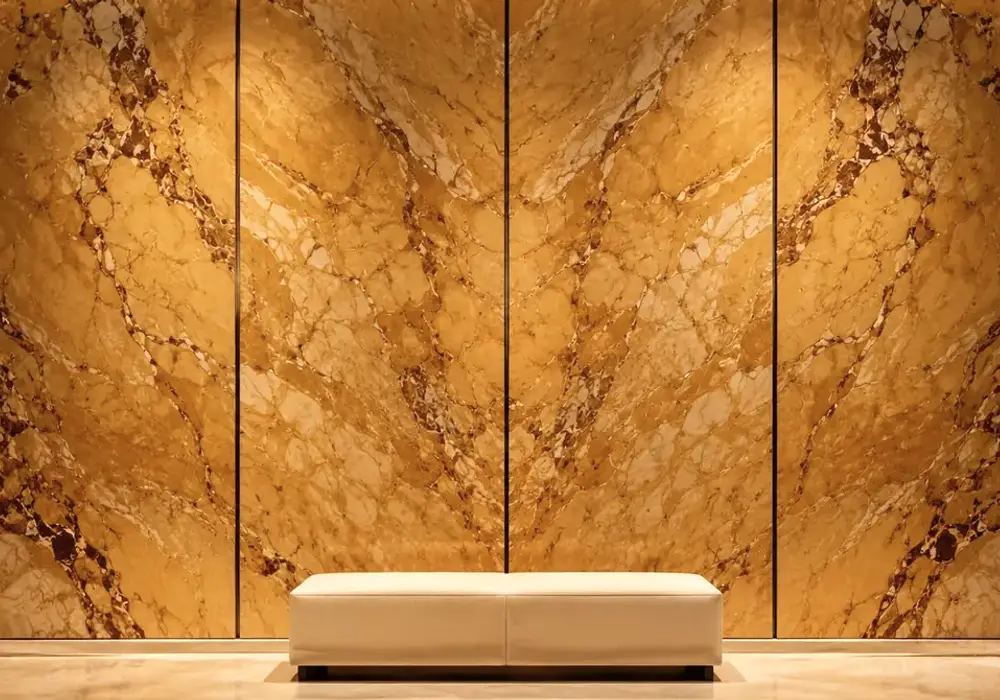 Giallo Siena marble luxury fireplace surround with rich golden-yellow stone and warm contrasting mineral veining.
