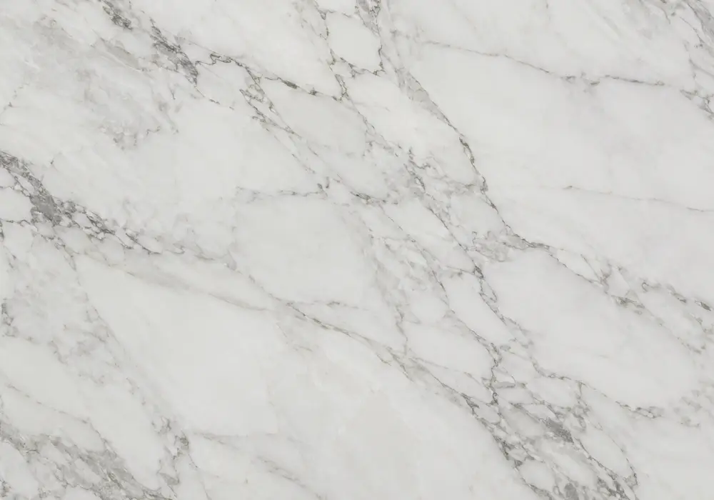 beige-gold marble in a luxury hotel lobby, showing natural stone texture, polished depth and refined architectural detail.