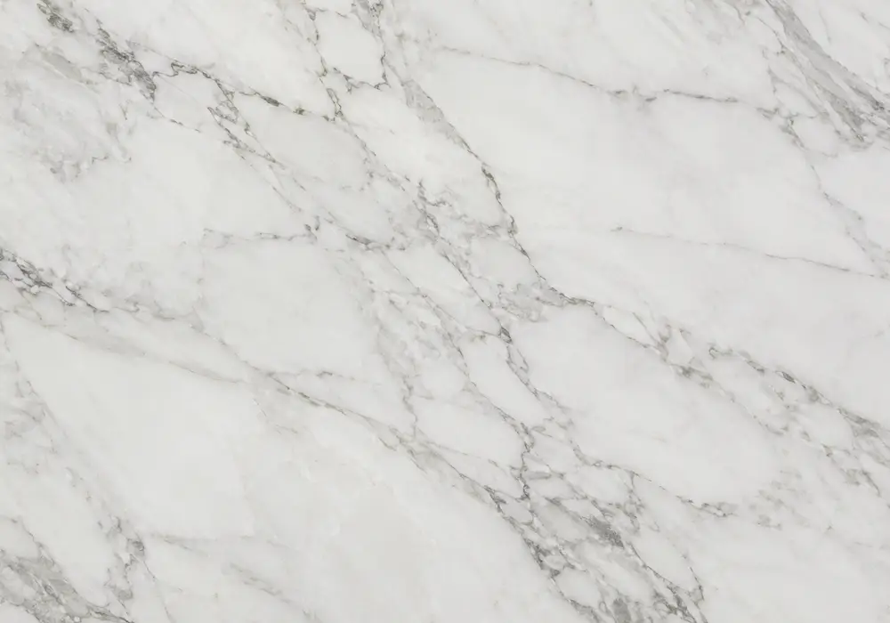 Gold Marble console tabletop in a refined stone showroom with natural slab displays and polished surfaces