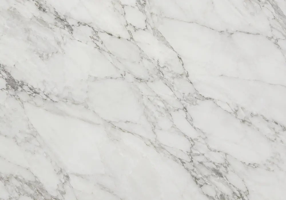 Golden Calacatta marble bookmatched feature panels with bright white stone and flowing warm gold-grey veining