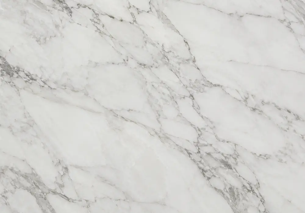 Golden Calacatta marble price view with gold and white, sweeping ribbons and branching veins, and delicate mineral contrast.