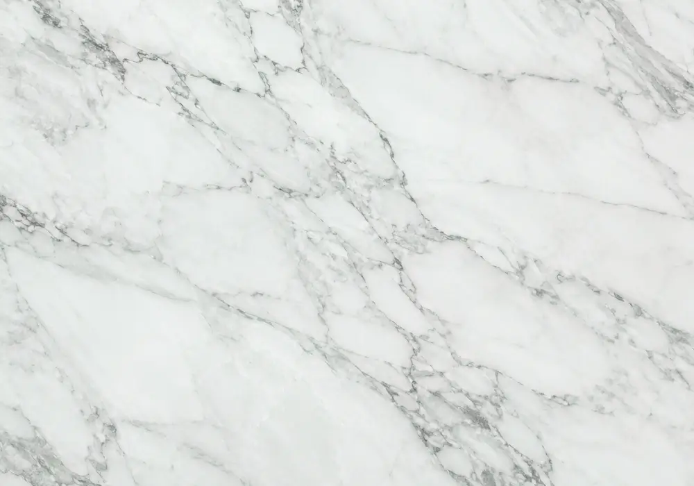Ming Green stone in a luxury hotel powder room, showing natural veining, realistic finishes and balanced interior lighting.