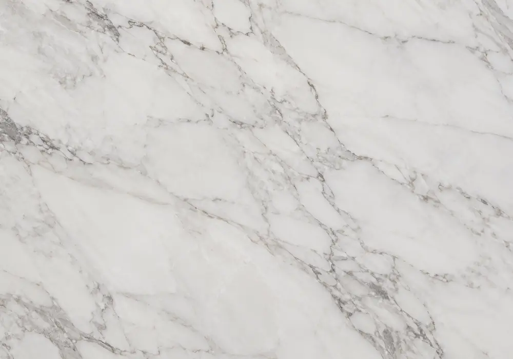 Grey Emperador Marble foyer reception wall displayed with full stone slabs in a contemporary luxury showroom