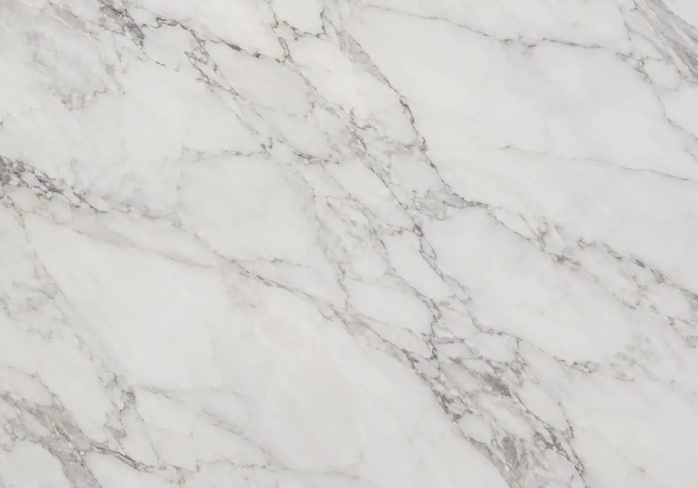 Hermes Grey flooring in honed cool-grey stone with polished kitchen counter and vanity showing fine white web veins and haze.
