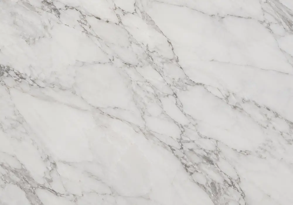 Hermes Grey marble dining table with cool grey stone and fine interconnected white and silver veining.