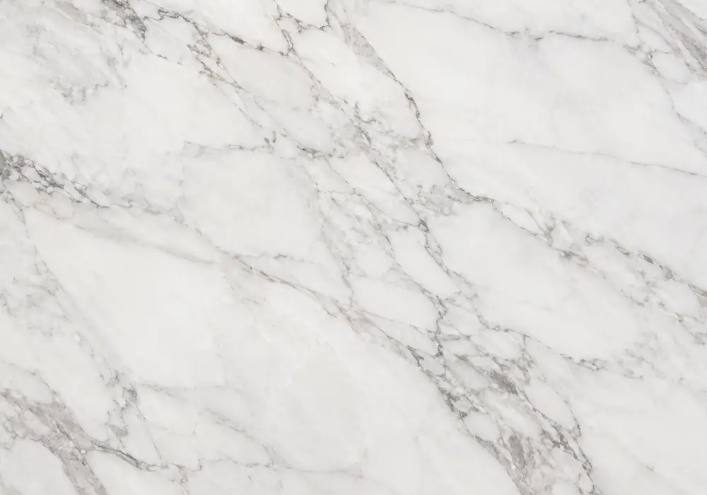 Ibiza marble bright fireplace surround with clean white stone and restrained soft-grey natural veining