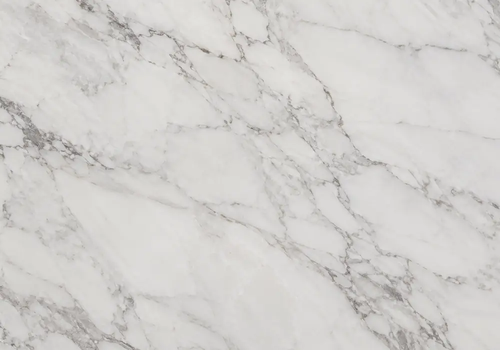 Ibiza marble slabs on polished wall cladding and kitchen surfaces with honed floors, stairs and bright white bathroom vanity.