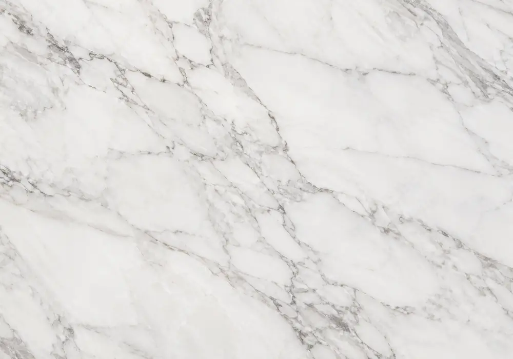 Ice Jade bookmatch across luminous feature wall with island and vanity, showing mint, icy green and dark fractured veins.