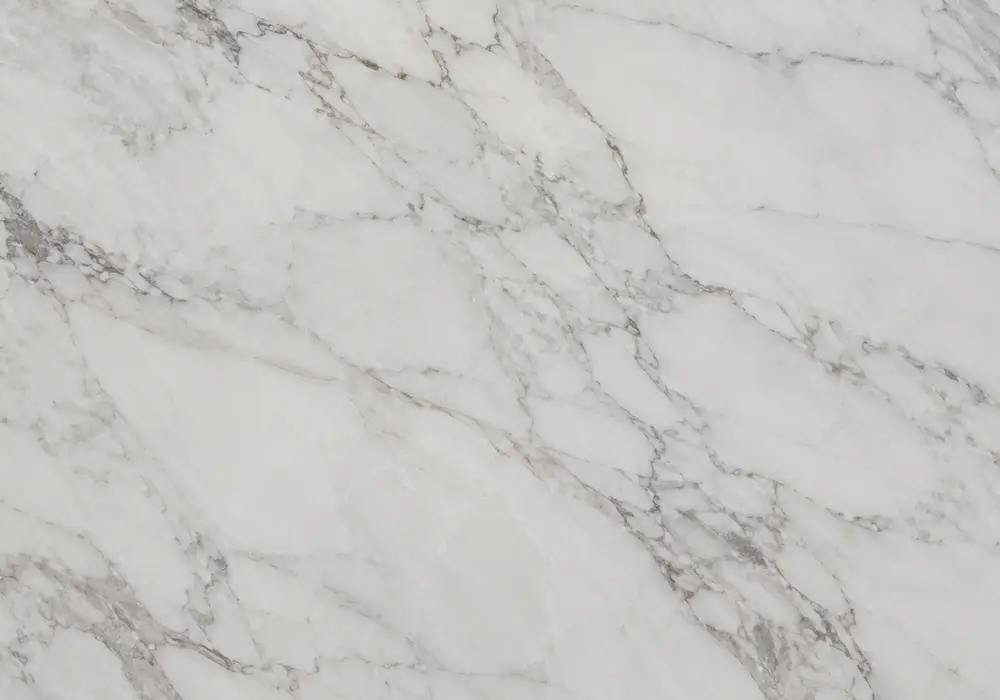 Compare Italian carrara marble price UAE through a cool-white slab with fine grey branches and classic blue-grey veining.
