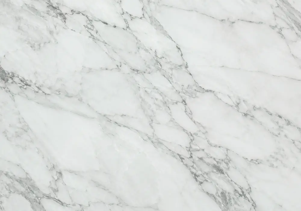 Verde Lapponia marble on island, bathroom wall and table with deep green fields, white folds and flowing water-like movement.